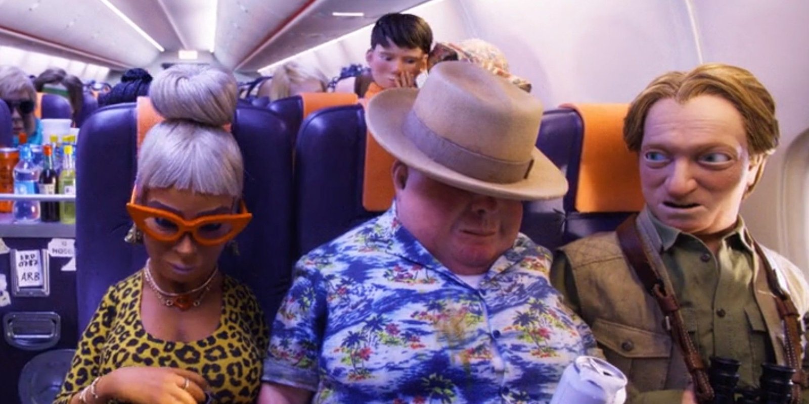 Charles Deetz with fellow passengers on the stop-motion plane in Beetlejuice 2