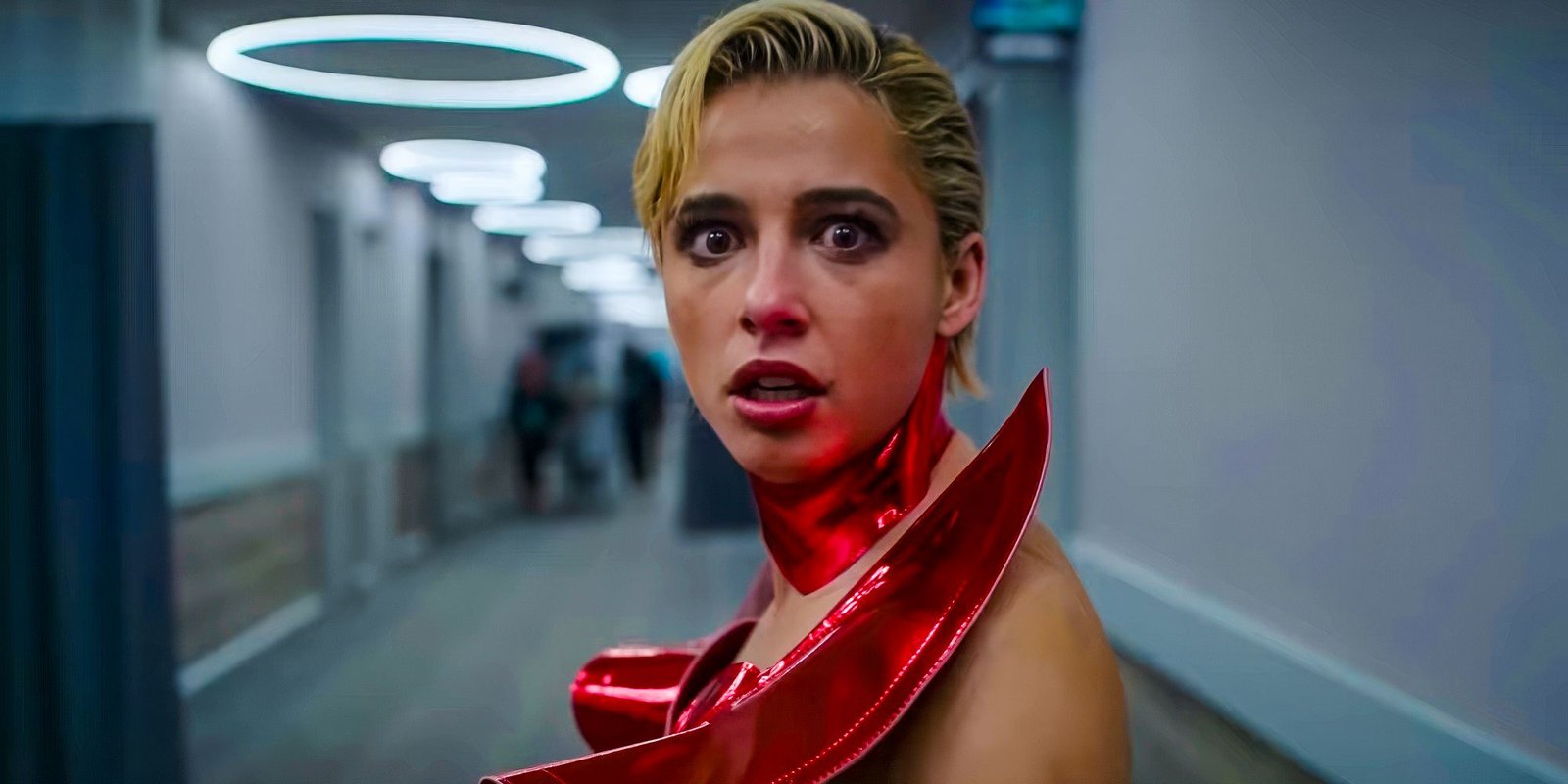Skye looking shocked in a red costume in Smile 2