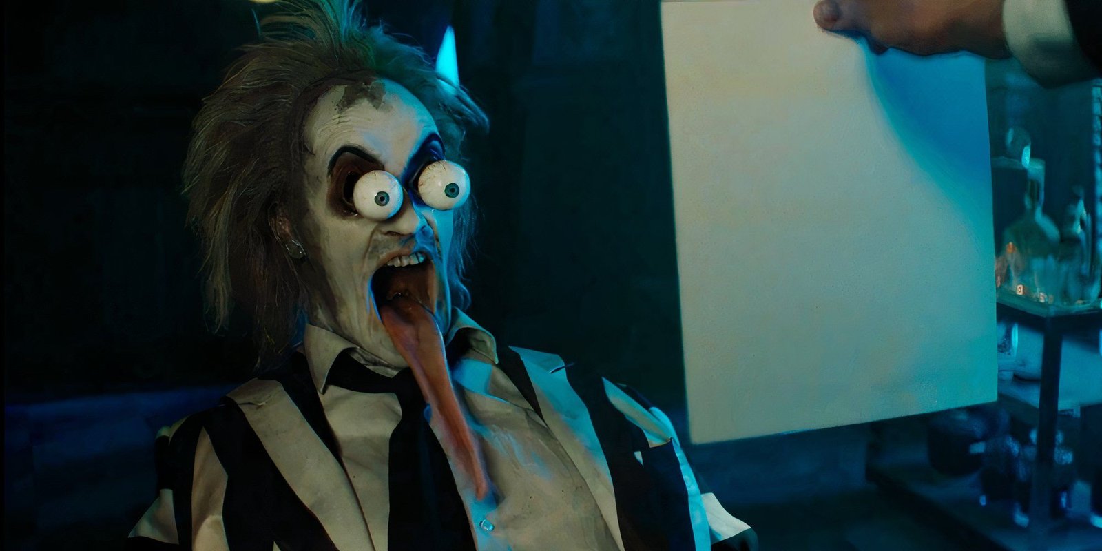 Michael Keaton as Betelgeuse bugging out his eyes in shock in Beetlejuice Beetlejuice
