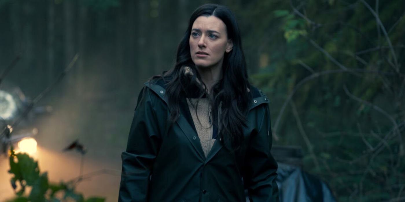Tess Avery (Dolly Lewis) walking through a crime scene in a forest scene in Sight Unseen.