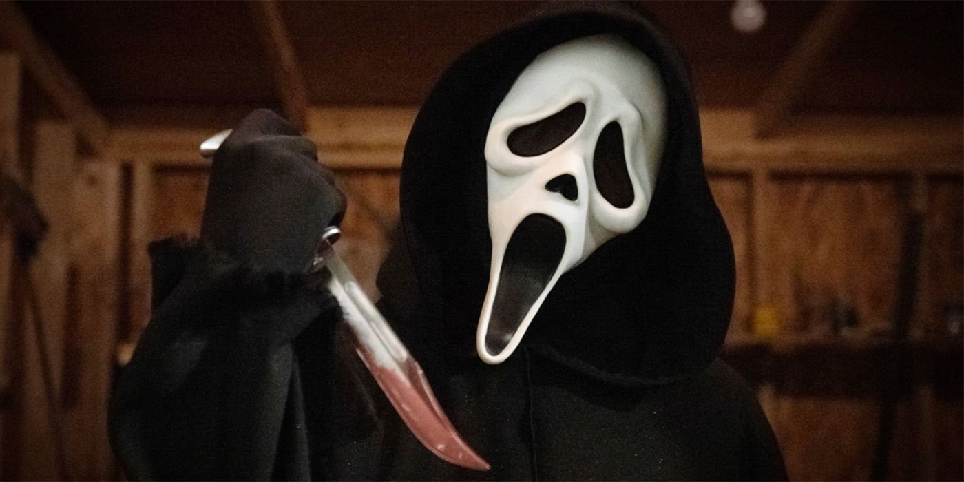 Ghostface with a bloody knife in Scream.