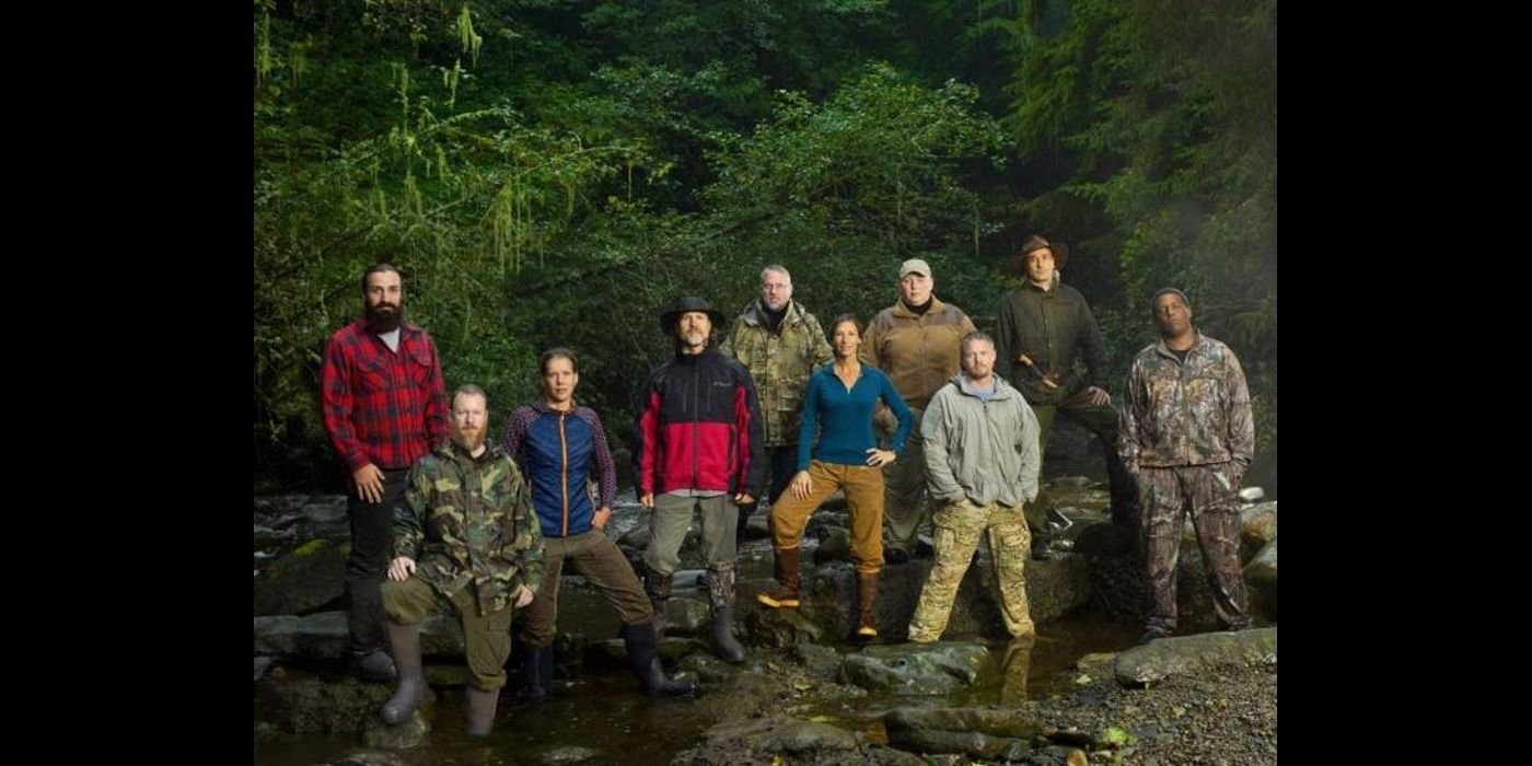 alone cast posing outdoors on a fallen tree