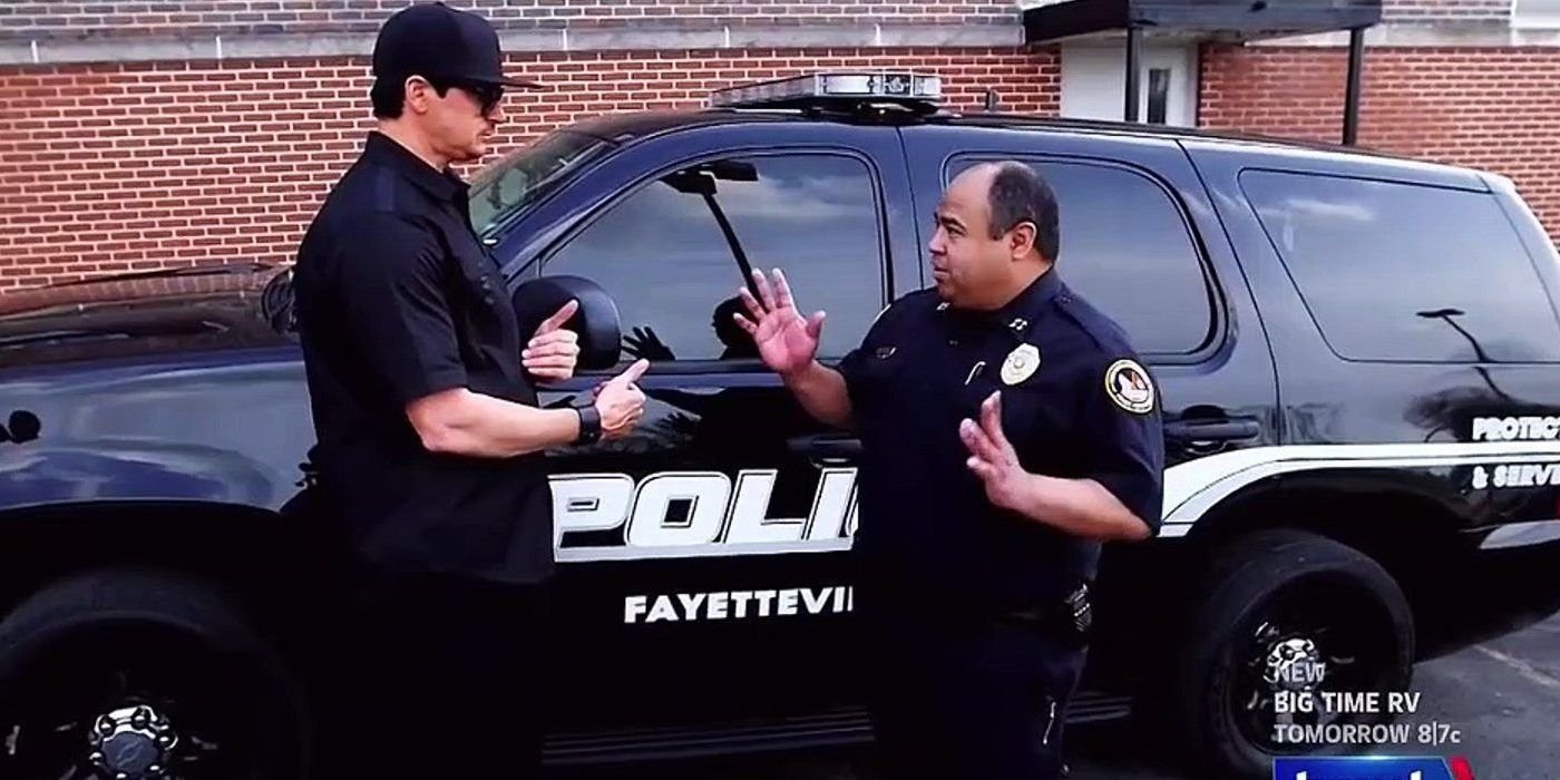 Zak Bagan talks with a police officer on Ghost Adventures