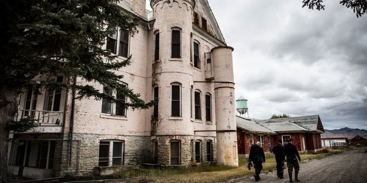 The Ghost Adventures crew walks past the Twin Bridges orphanage