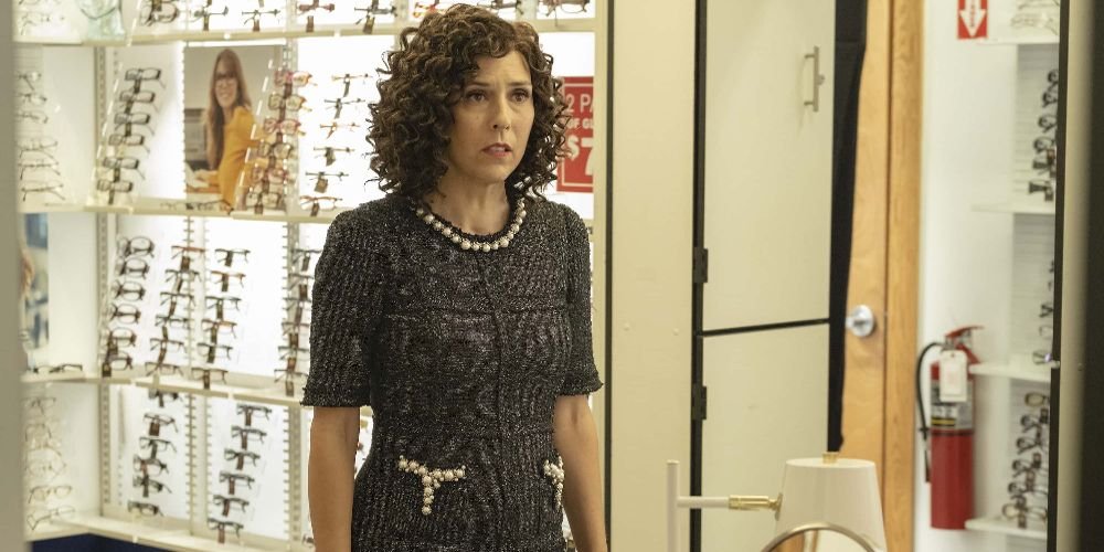 Judy stands in the optometrist office on The Righteous Gemstones