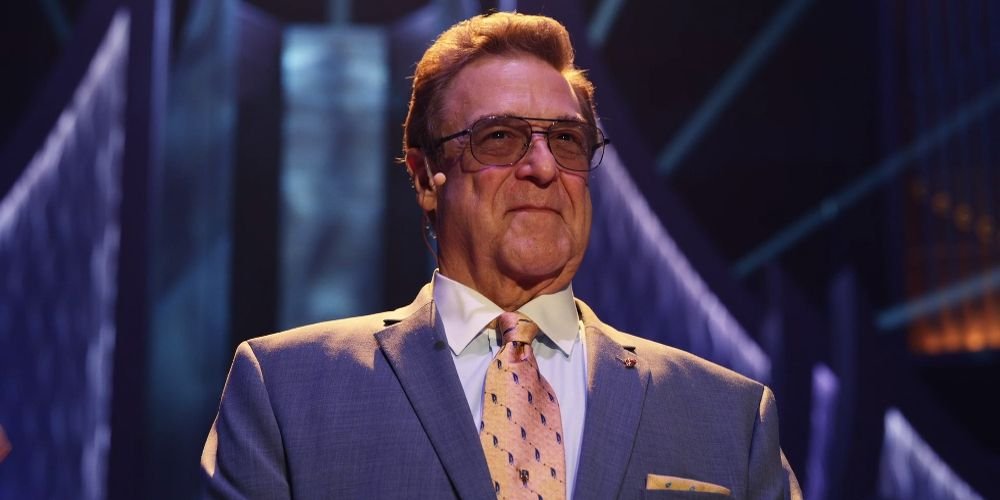 Eli smiling while on a stage in The Righteous Gemstones