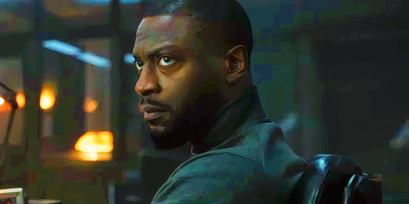 Aldis Hodge as Alex Cross looking up from a desk in Cross