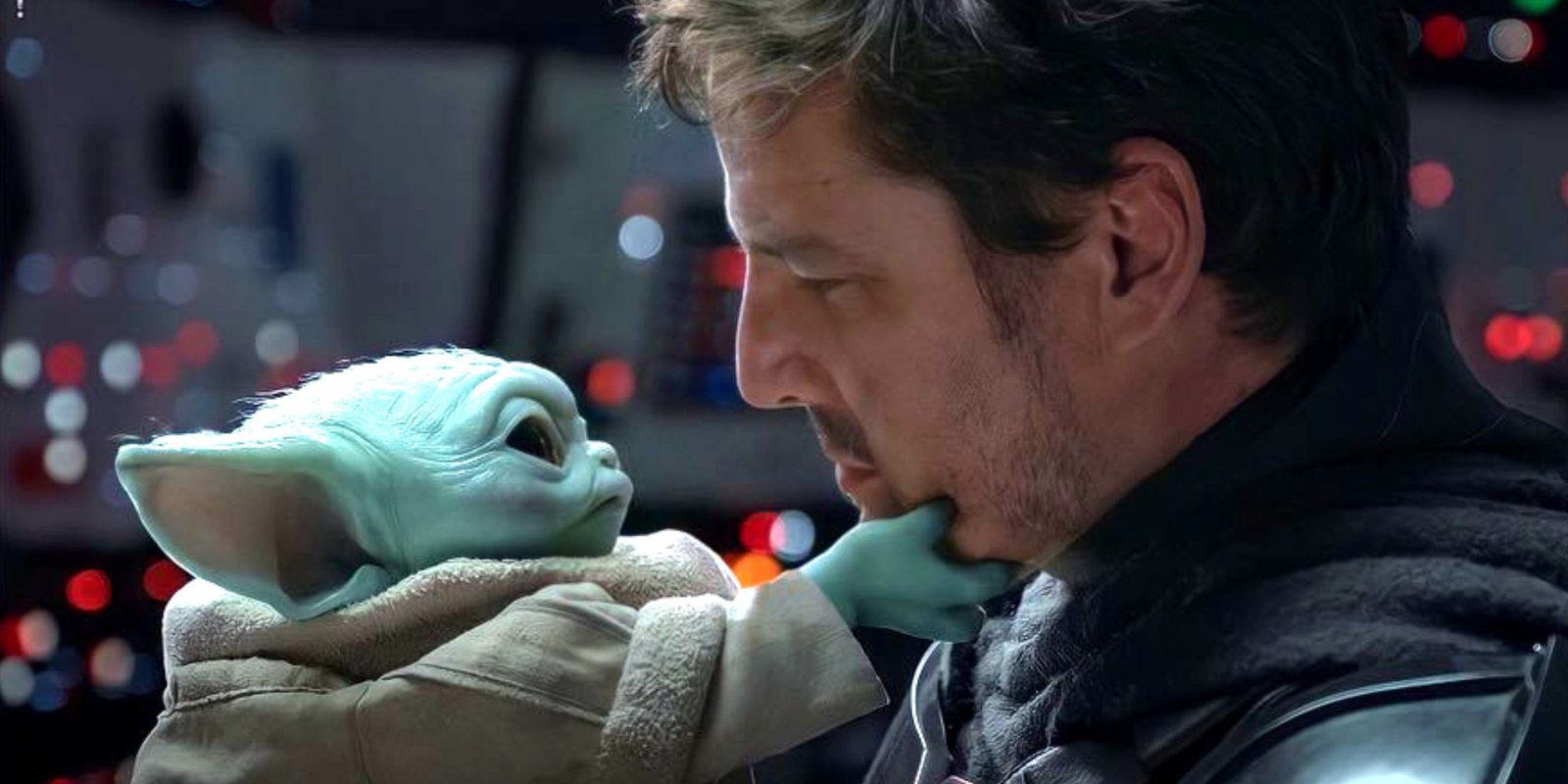 Din Djarin And Grogu Say Goodbye In The Mandalorian Chapter 16 with Grogu reaching up to grab Din Djarin's face