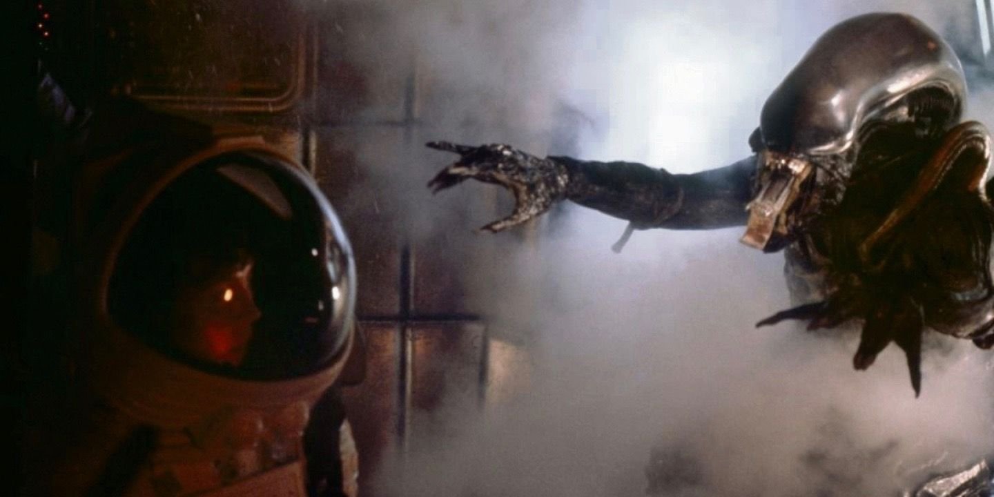 The Xenomorph reaches for Ripley (Sigourney Weaver) as she hides in a space suit in Alien (1979)