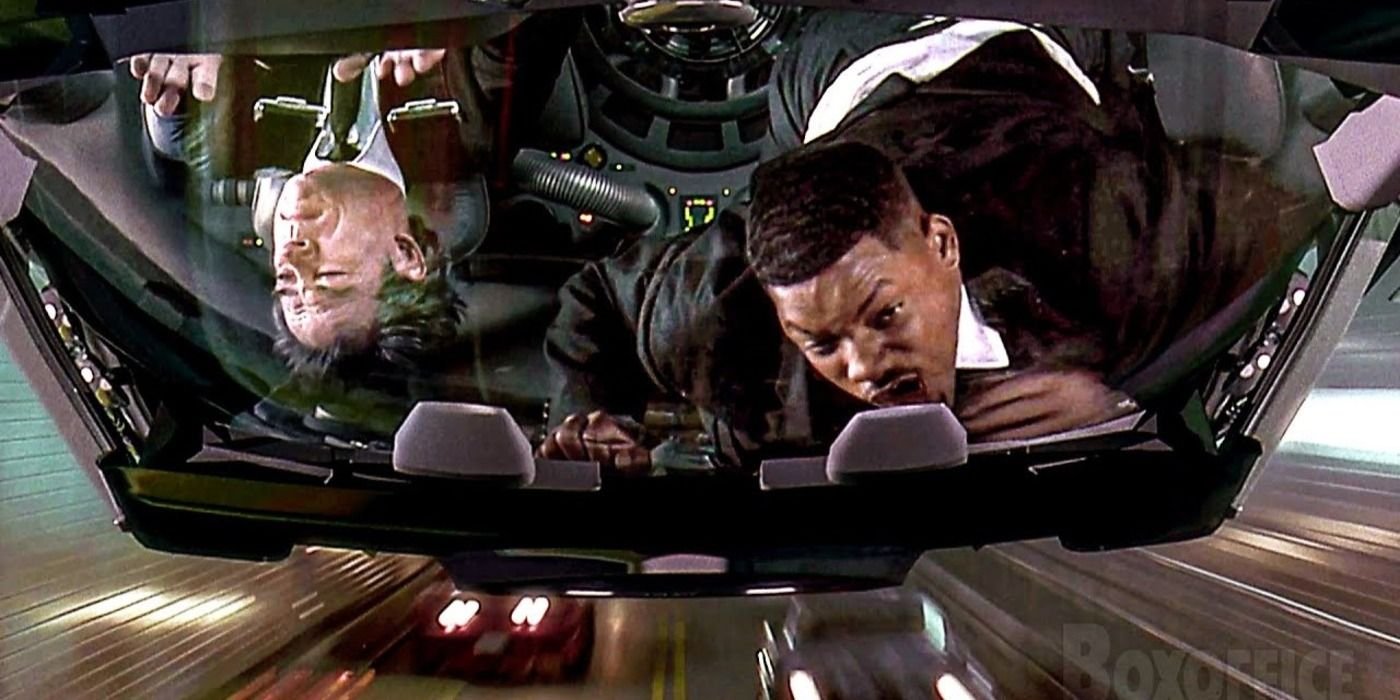 Agent J (Will Smith) and Agent K (Tommy Lee Jones) during the tunnel chase scene in Men in Black (1997)