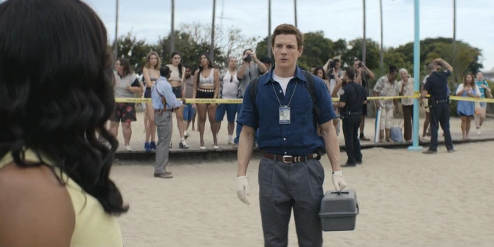 Dexter Morgan (Patrick Gibson) standing awkwardly at a crime scene in Dexter: Original Sin season 1, episode 4