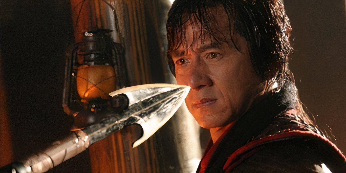 All 3 Movies In Jackie Chan & Chris Tucker's Buddy Cop Franchise Are Available On Netflix, And Another Sequel Is Still In The Works 2 Jackie Chan looking at spear tip in The Twins Effect 2 (2004)