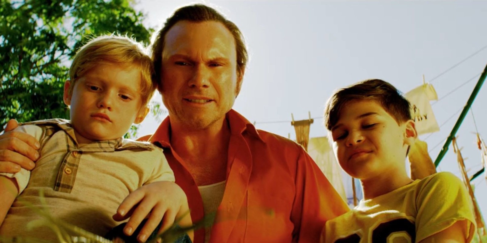 Harry Morgan (Christian Slater) looks at dead lizards with young Dexter and Brian Moser in Dexter: Original Sin season 1, episode 4