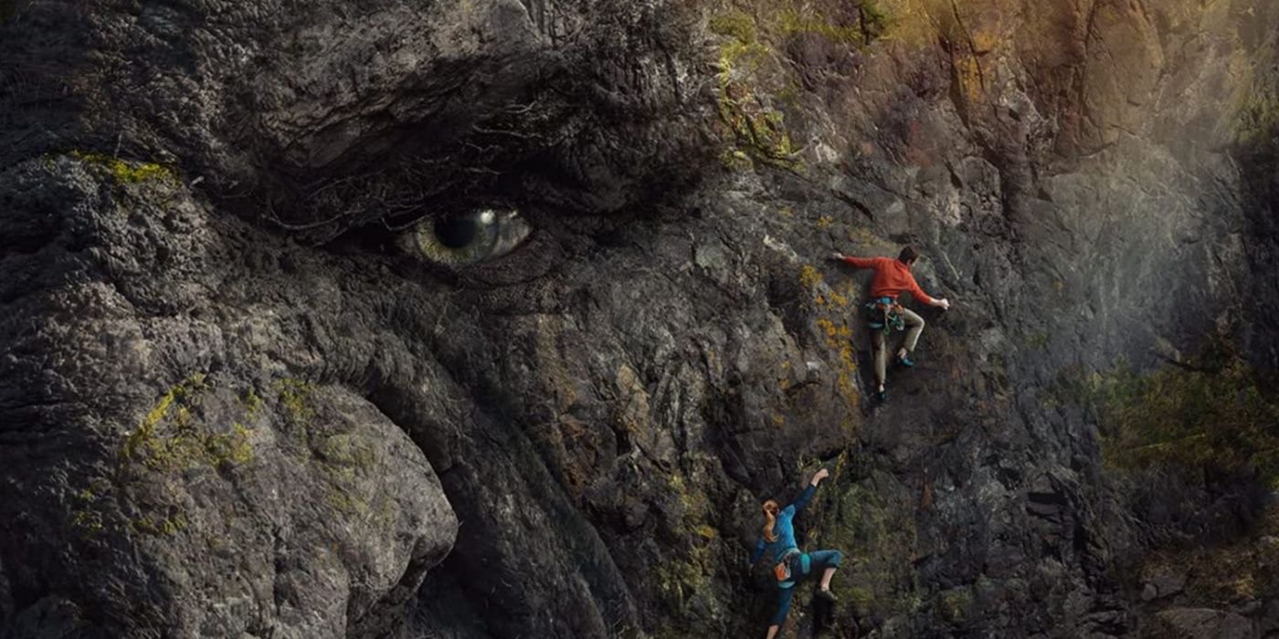 Two people climb the troll's face like it's a mountain in a promo image for Troll on Netflix