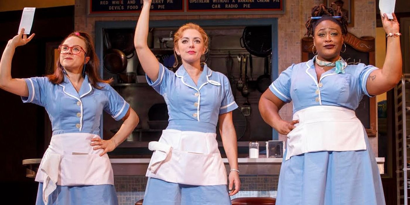 An image of three Waitress characters waiving their receipts in a musical