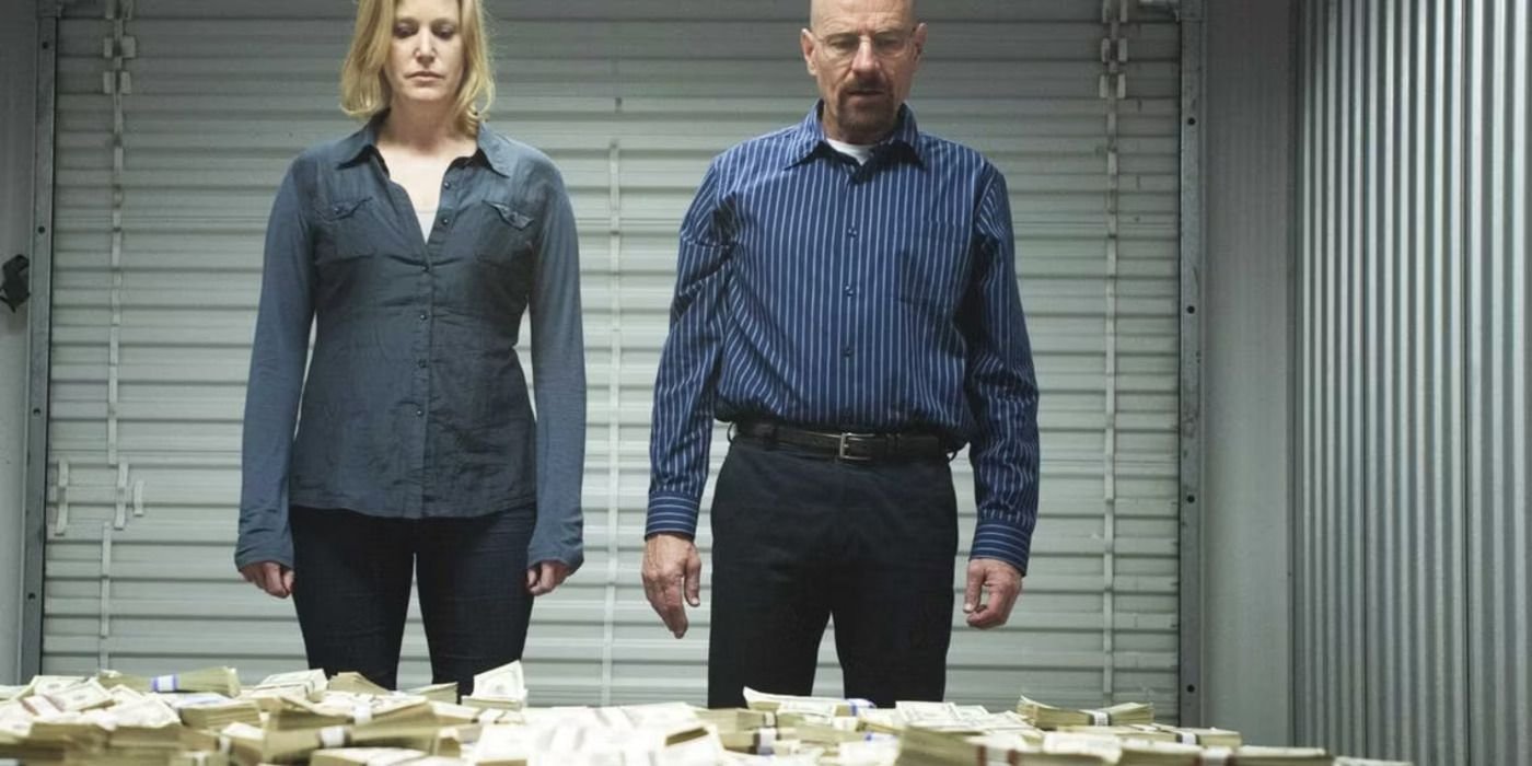 Walter (Bryan Cranston) and Skyler White (Anna Gunn) looking at their big pile of money in Breaking Bad.