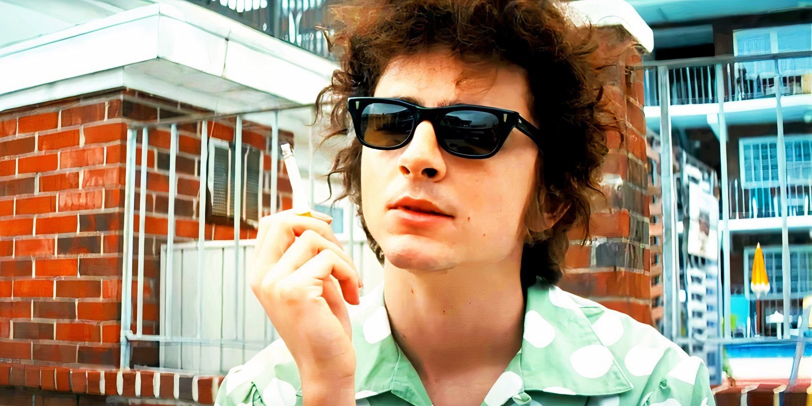 Timothée Chalamet smoking a cigarette as Bob Dylan in A Complete Unknown