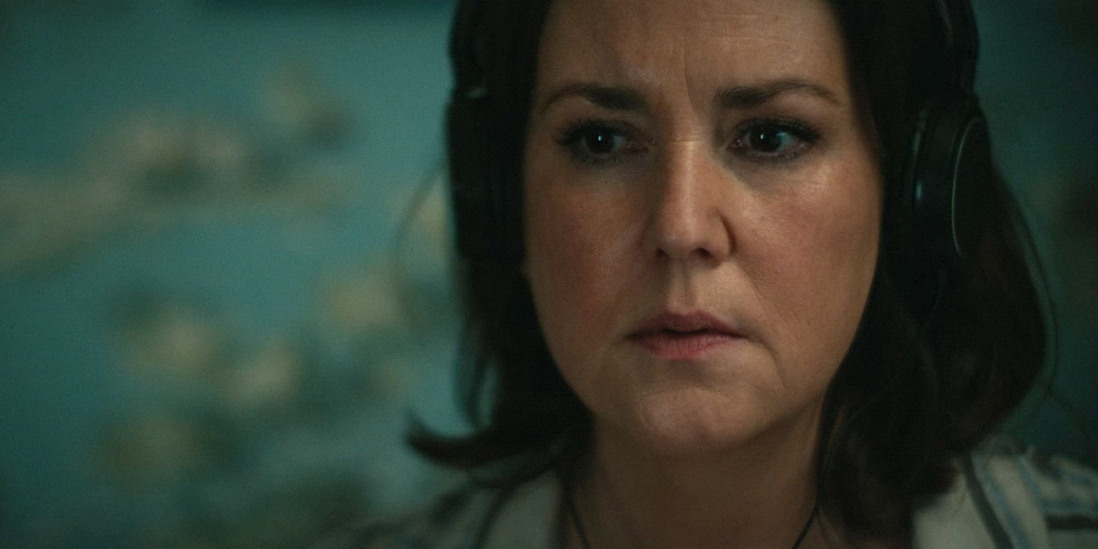 Shauna (Melanie Lynskey) listening to the recording left for her in Yellowjackets Season 3 Episode 7