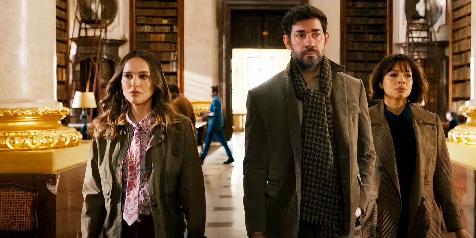 John Krasinski and Natalie Portman walking into a library in Fountain of Youth