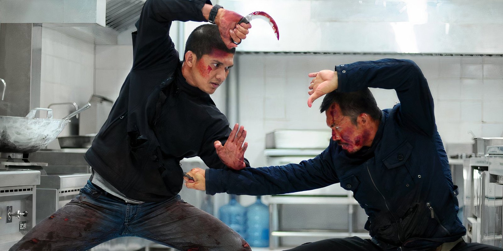 Iko Uwais squaring up to an opponent in The Raid 2