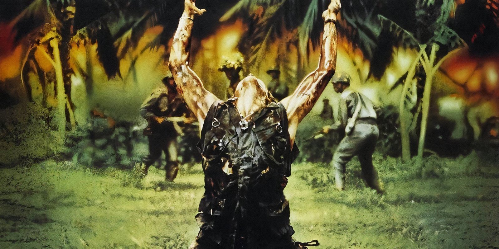 Willem Dafoe throws his arms up as Elias in Platoon
