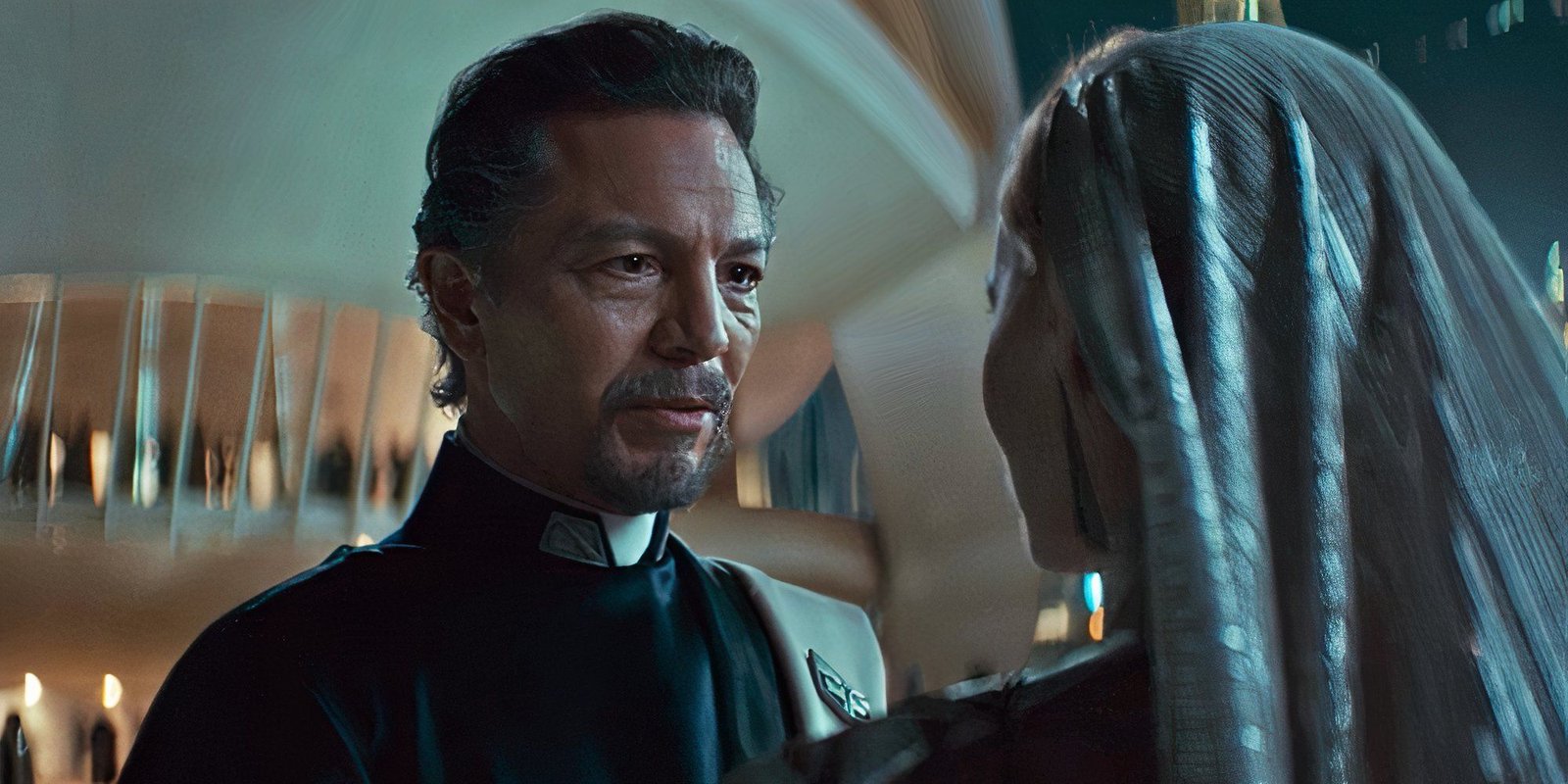 Bail Organa (Benjamin Bratt) speaks to Mon Mothma (Genevieve O'Reilly) outside the Sculder party on Coruscant.