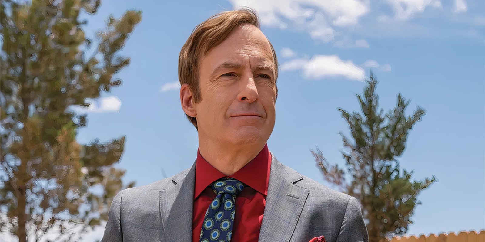 I'll Never Watch Better Call Saul The Same Again After Learning Who Almost Played Saul Goodman Before Bob Odenkirk 4 bob odenkirk as saul goodman wearing a suit with a red shirt and blue tie in better call saul