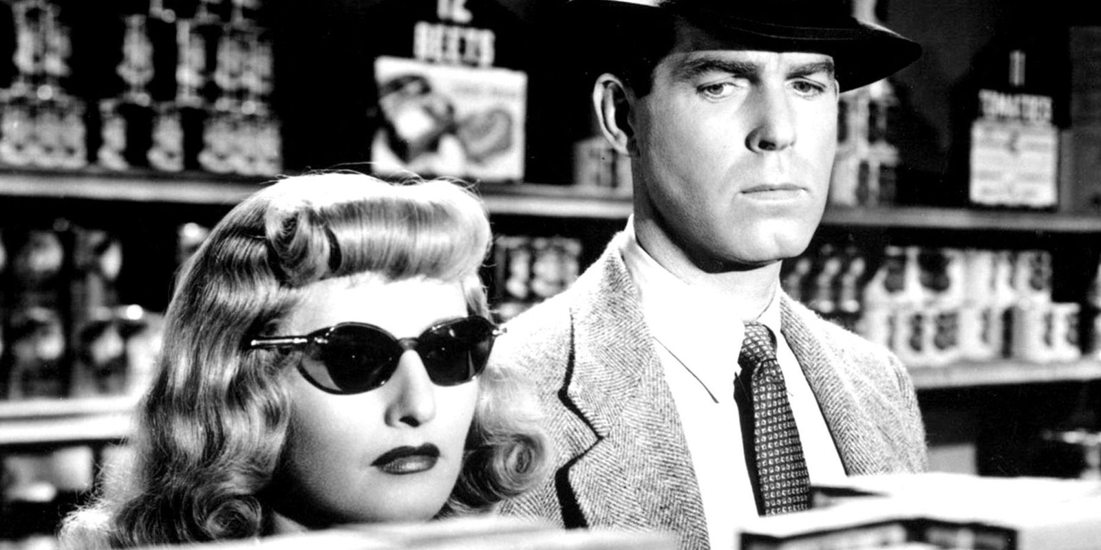 Listen Up, Hollywood! These 8 Comics Would Make For Some Excellent Movies 5 Barbara Stanwyck wearing sunglasses next to Fred MacMurray in Double Indemnity (1944)