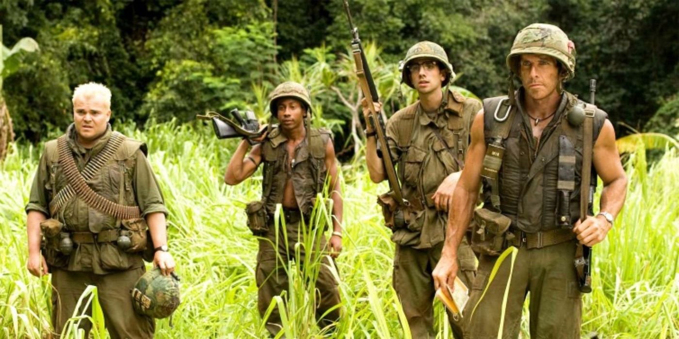 Jack Black, Brandon T. Jackson, Jay Baruchel, and Ben Stiller as in army gear and holding guns in Tropic Thunder.