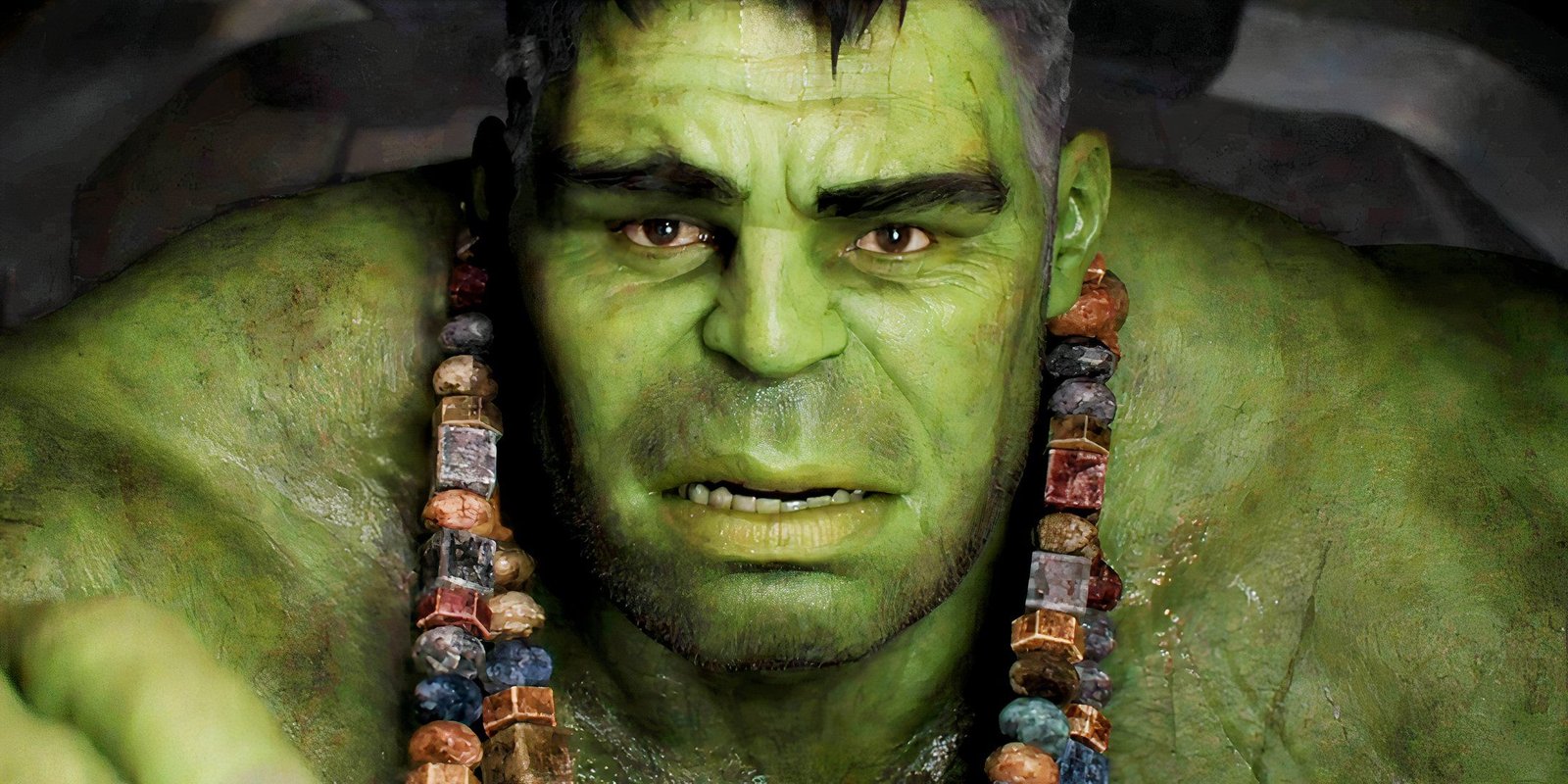Close up of Hulk looking sad with necklaces around his neck in Thor Ragnarok