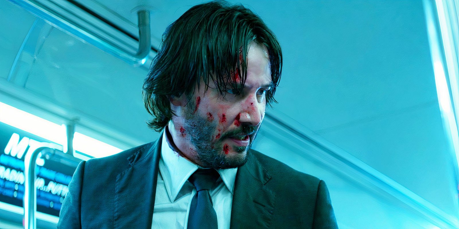 Keanu Reeves looking angrily to one side as John Wick in John Wick: Chapter 2