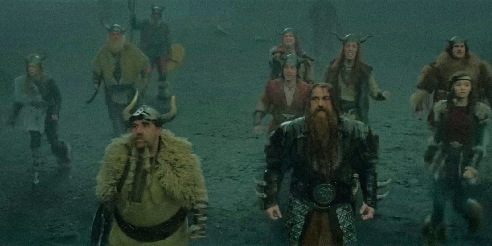 A group of Vikings surprised to see dragons in How To Train Your Dragon (2025)
