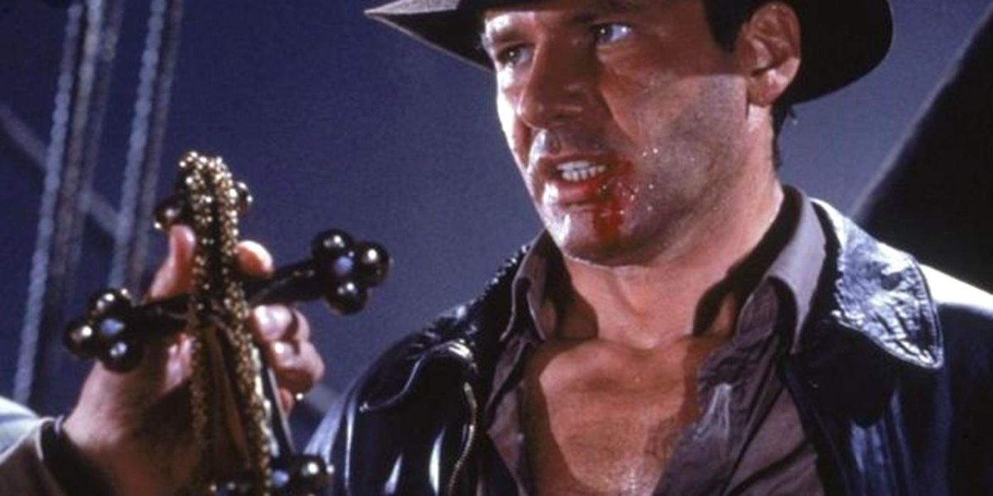 Indy looking at cross in The Last Crusade