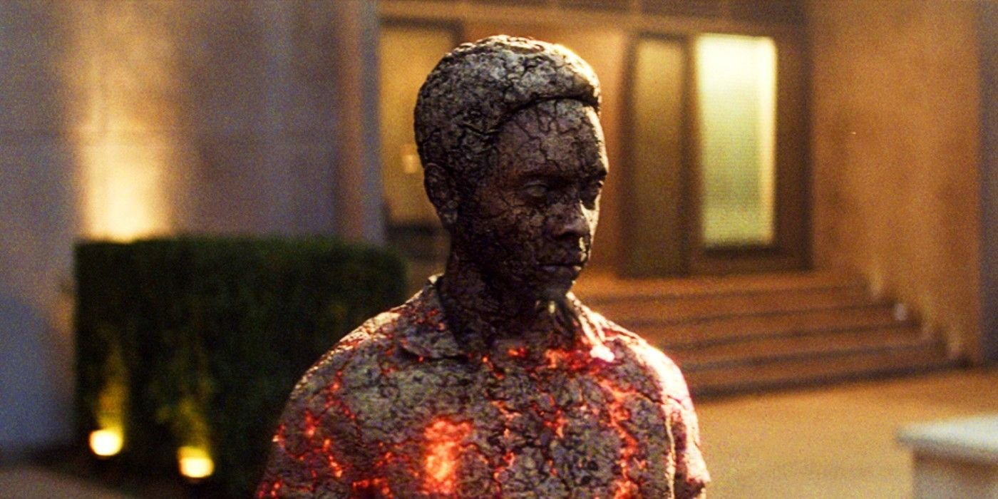 Edi Gathegi's Darwin covered in ash with his chest glowing in X-Men: First Class
