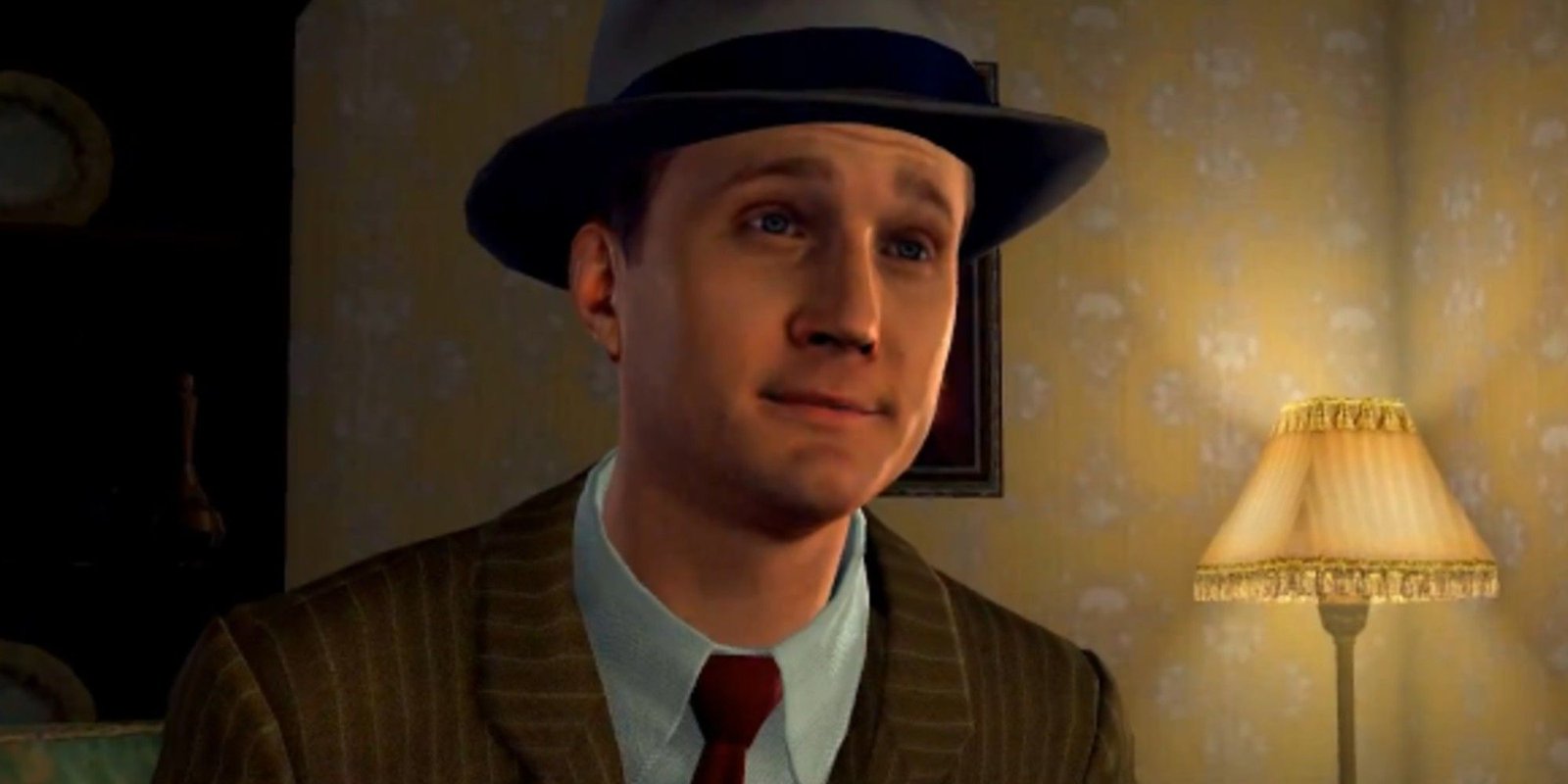Cole Phelps raising his eyebrows in L.A. Noire in front of a yellow wallpaper and lamp.
