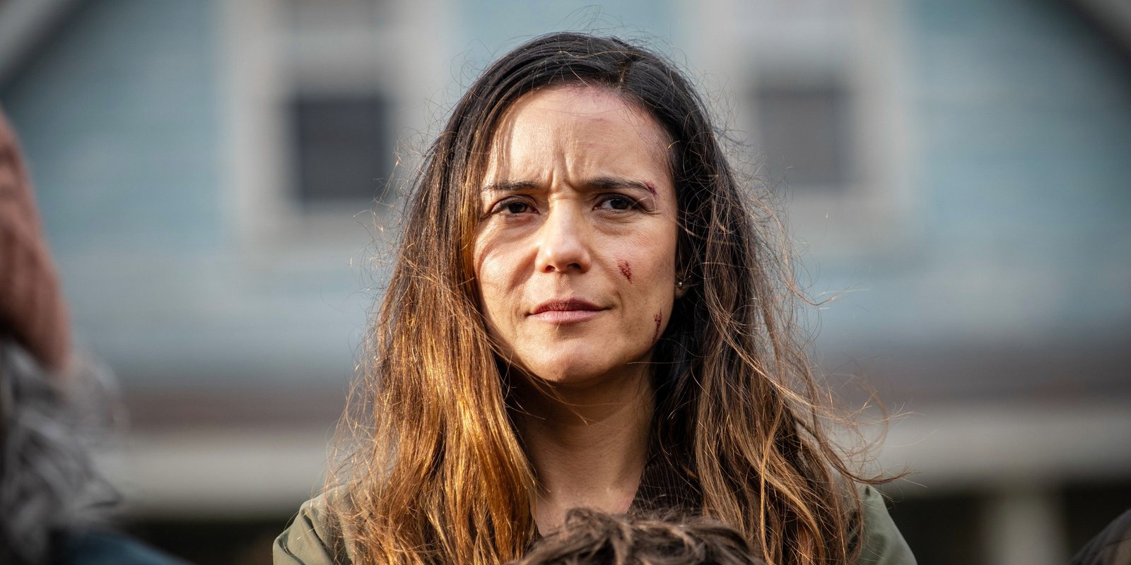 Tabitha looking serious with scratches on her face in From season 3