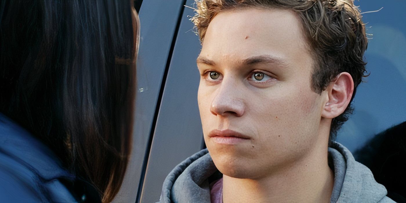 Finn Cole as J staring intently at a character in Animal Kingdom season 1