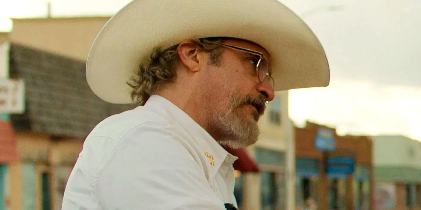 Joaquin Phoenix wearing a cowboy hat and looking to the right in Eddington
