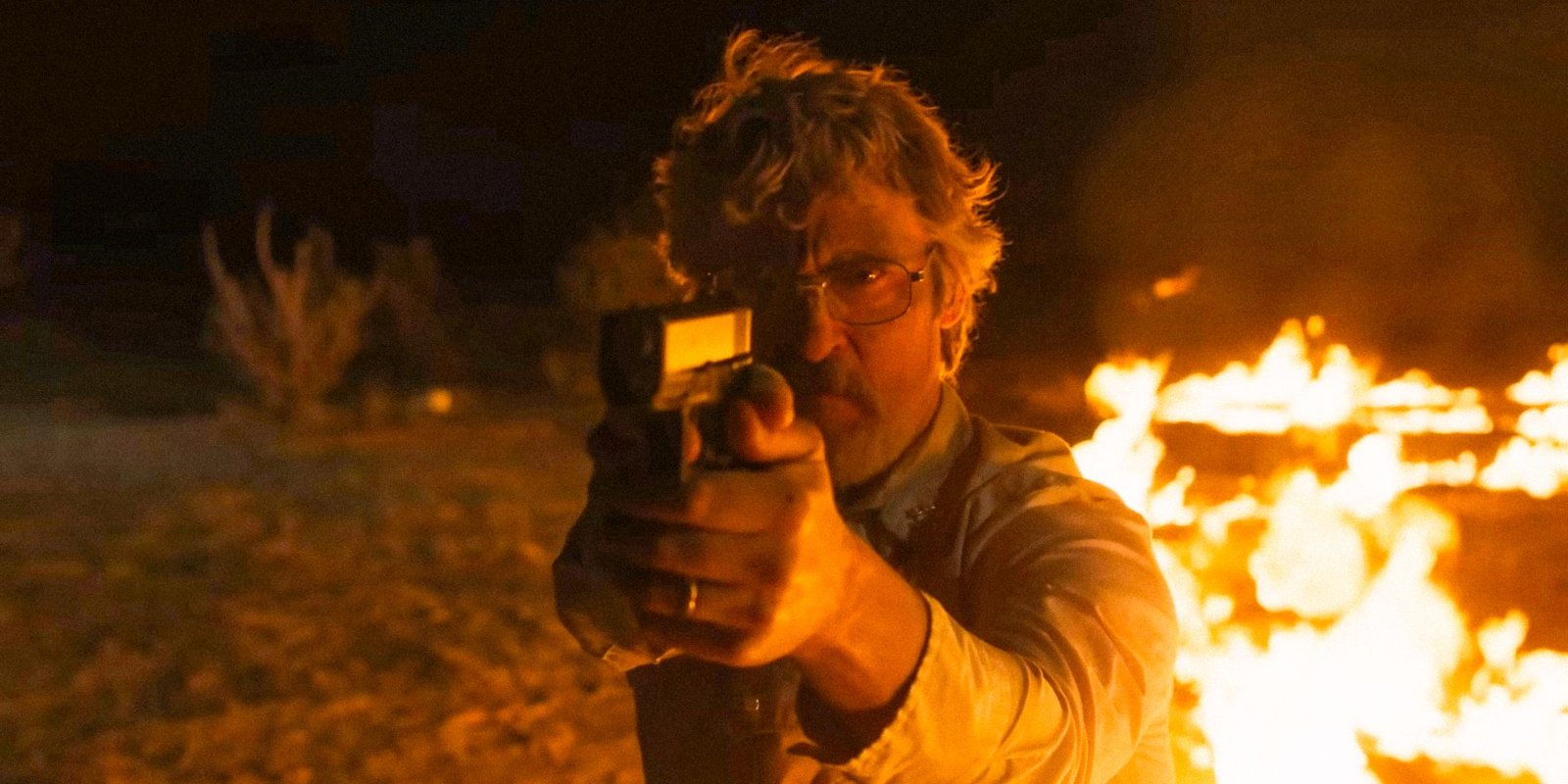 Joe Cross (Joaquin Phoenix) pointing a gun in Eddington