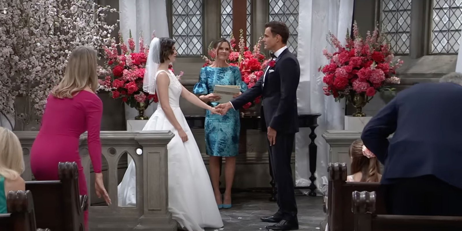 General Hospital Drew and Willow standing at the altar with bridesmaids behind them and audience members sitting down