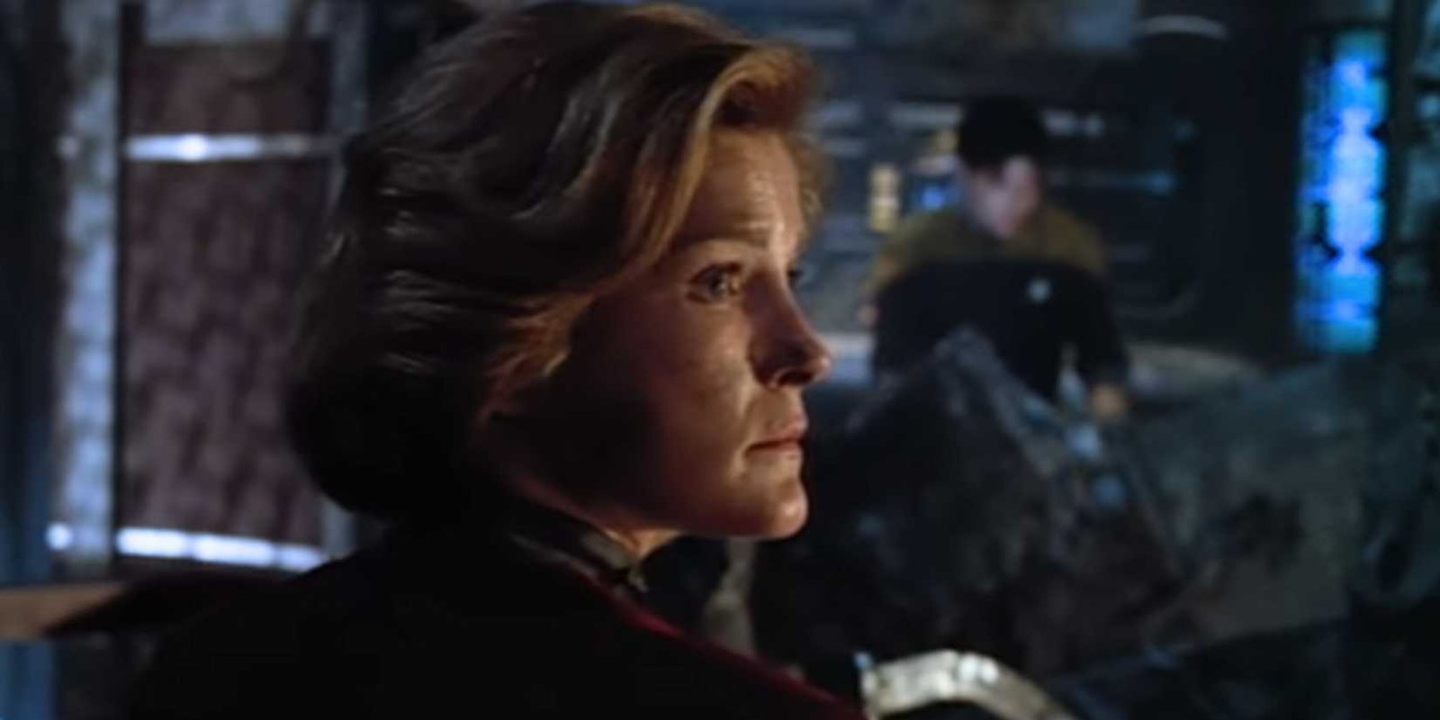 Kate Mulgrew looking stern at something off-screen as Captain Janeway in Star Trek: Voyager.