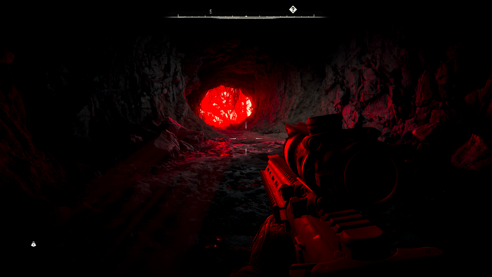 STALKER 2 screenshot showing Skif in a pitch-black cave, illuminated by the bright red light of an Emission occurring outside the cave's mouth.