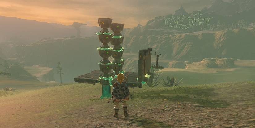 Link standing in front of an Ultrahand build utilizing Construct Heads amongst other Zonai Devices in The Legend of Zelda: Tears of the Kingdom.