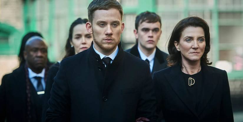 Sean Wallace (Joe Cole) and Marian Wallace (Michelle Fairley) in black in Gangs of London