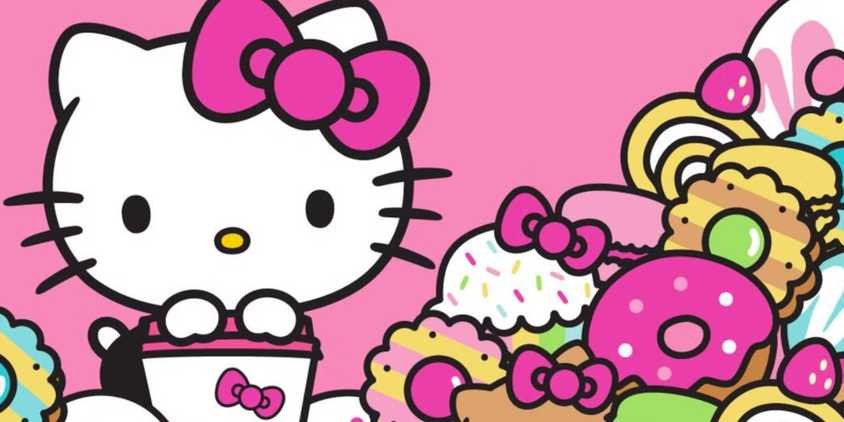 Mark Your Calendars, June 29th Will Be a Big Day for Hello Kitty and Sanrio Fans 3 Hello Kitty holds a bucket next to a mountain of candy and pastries