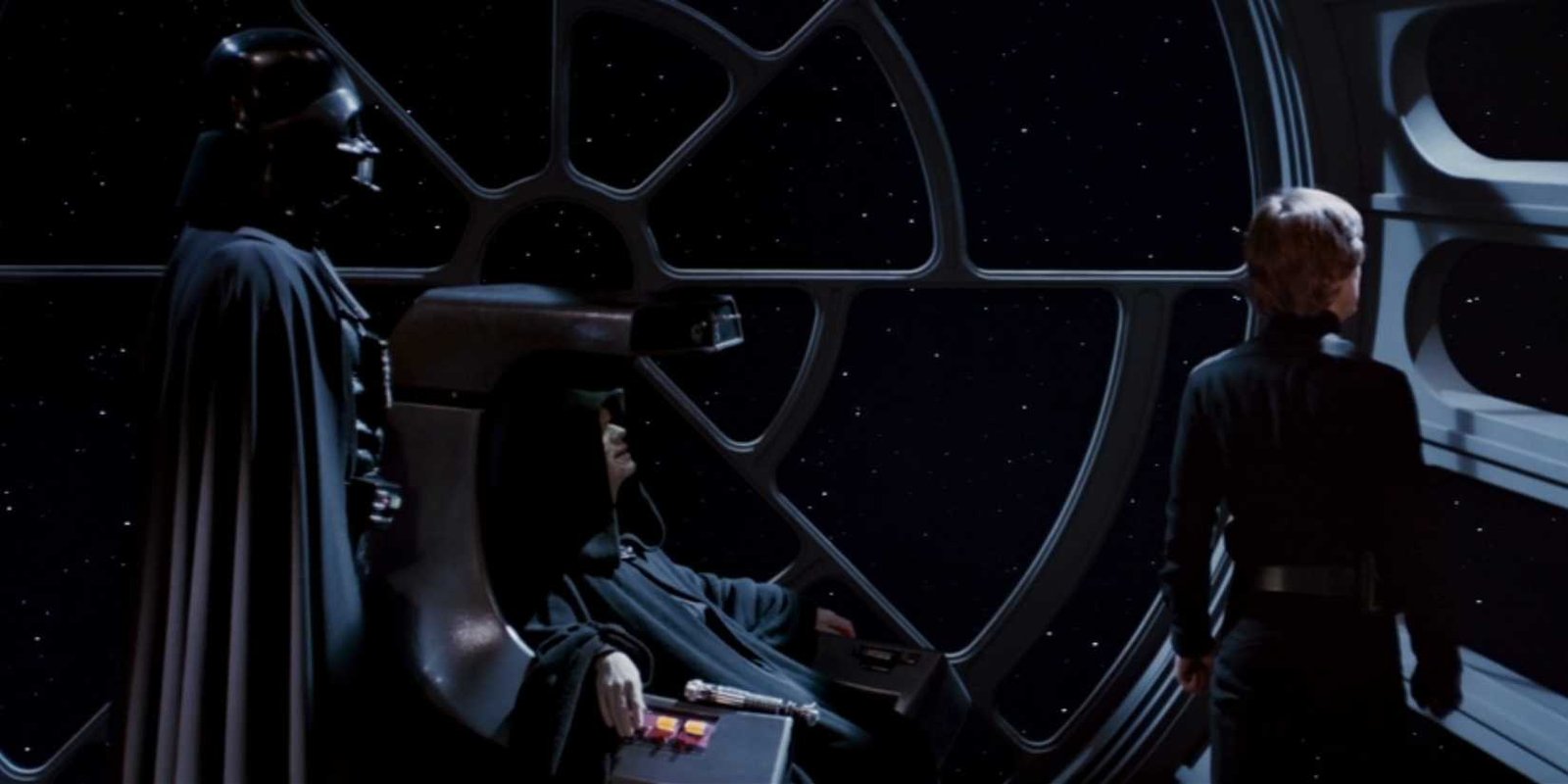 Palpatine sits on his throne with Darth Vader behind him and Luke Skywalker in front of him all looking out the window