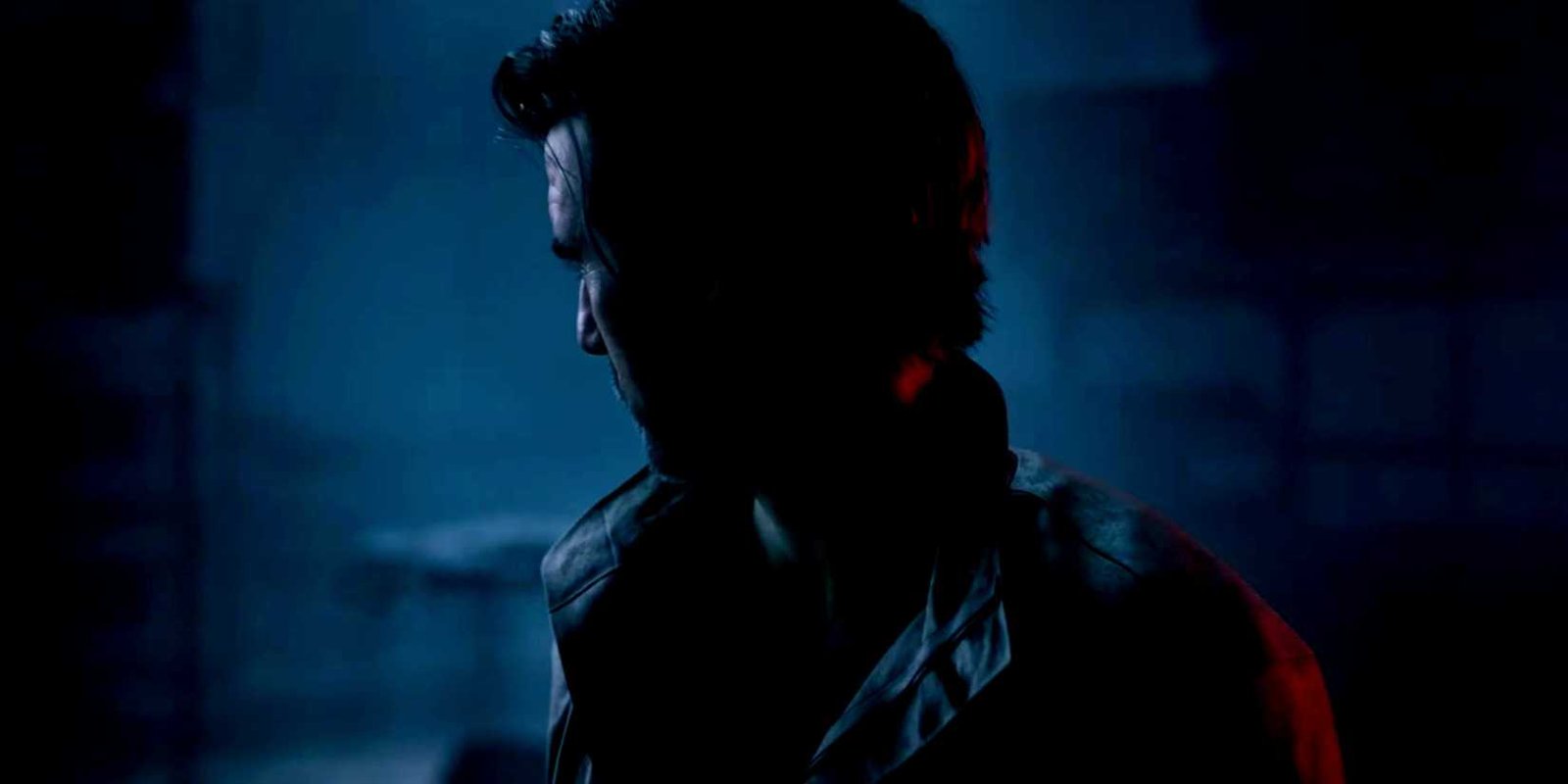 Black Ops 7 protagonist looking away from the camera in shadow