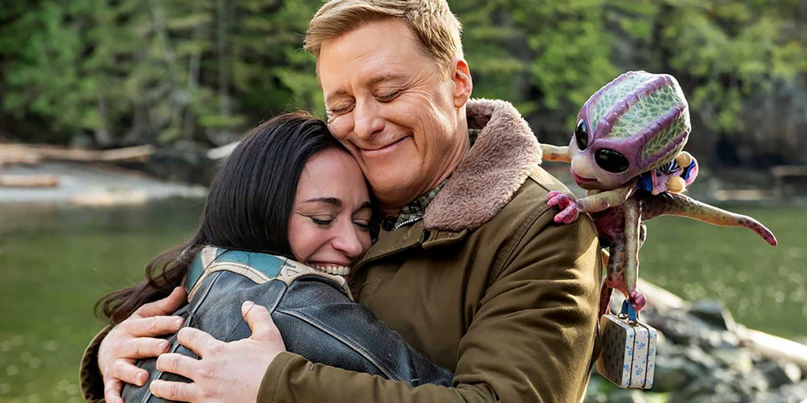 Asta, Harry and Bridget smiling while they hug goodbye in Resident Alien season 4 finale