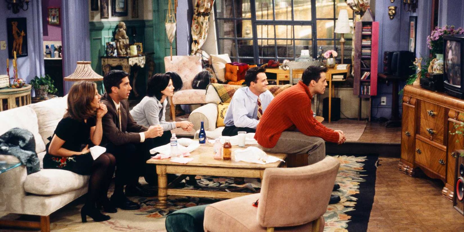 Friends the group at Monica's apartment watching TV